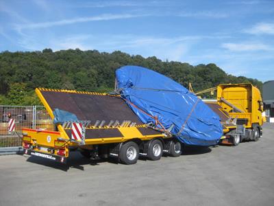 Flatbed trailer with 3 to 8 axles for crane components and crane weights.