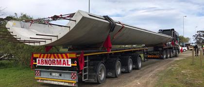Absolute Wind and one of its flatbed trailers working in South Africa