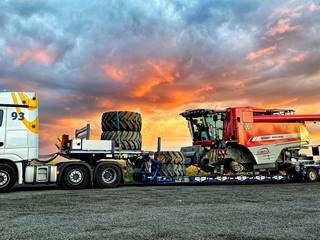 This 2-axle MegaMAX low bed trailer is working to load agricultural machinery