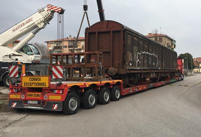 Railway vehicles on lowbed trailers