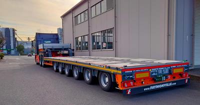 Daikyo Kenki Co., Ltd. moves different machinery on a 6-axle semi low loader through Tokyo