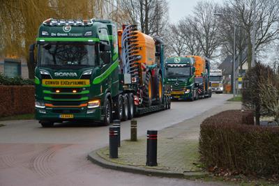 Some new manure vehicles are being transported by the Dutch company De Groen Transport on several low loaders.